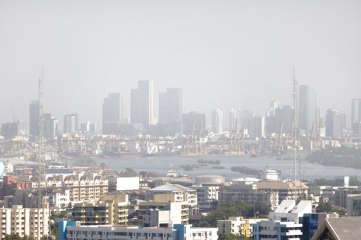 Downtown skyscrapers of the city of Bankok. Poor visibility, smog, caused by dust and smoke high level PM2.5  air pollution.