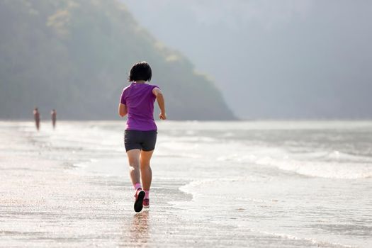 Fitness runner woman on ao nang beach  Krabi  Thailand