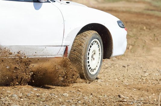 Rally car turning in track