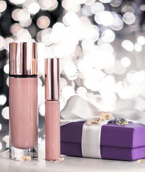 Cosmetic branding, Christmas glitter and girly blog concept - Holiday make-up foundation base, concealer and purple gift box, luxury cosmetics present and blank label products for beauty brand design