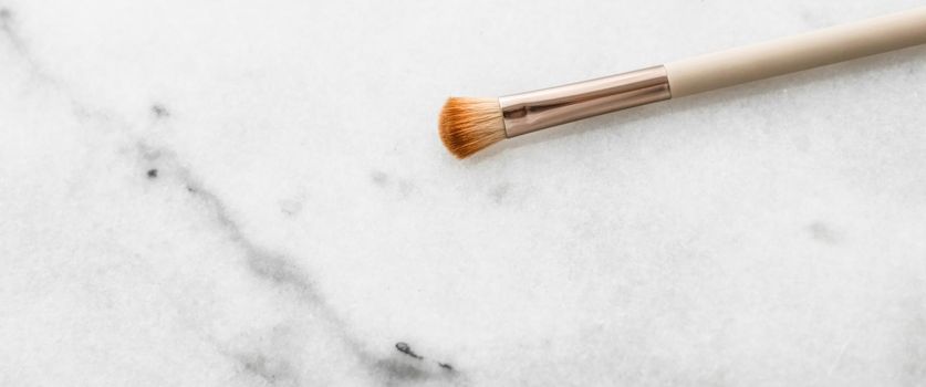 Cosmetic branding, blog and girly concept - Make-up brush for foundation base face contouring on marble background, mua cosmetics as glamour makeup artist product for luxury beauty brand art design