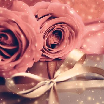 Vintage design, shop sale promotion and happy surprise concept - Luxury holiday golden gift box and bouquet of roses as Christmas, Valentines Day or birthday present