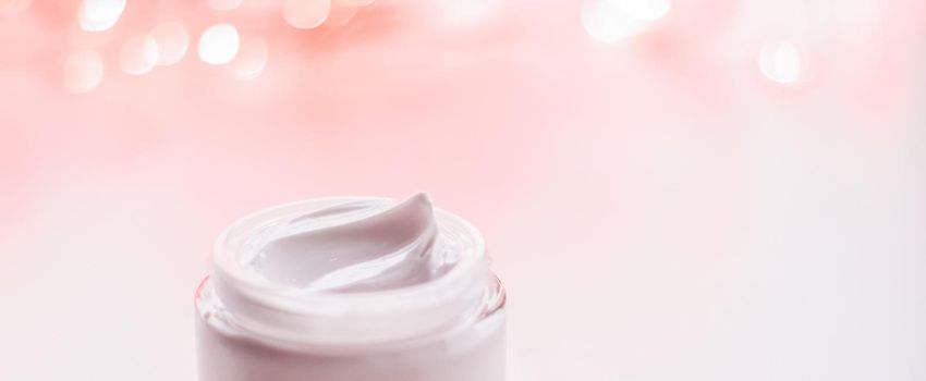 Cosmetic branding, gift and spa concept - Facial cream moisturizer jar on holiday glitter background, moisturizing skin care as lifting emulsion, anti-age cosmetics for luxury beauty skincare brand