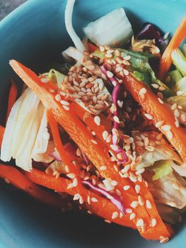 Vegan dieting, eating out and oriental cuisine concept - Vegetarian asian vegetable salad served in a bowl in japanese restaurant, healthy diet food