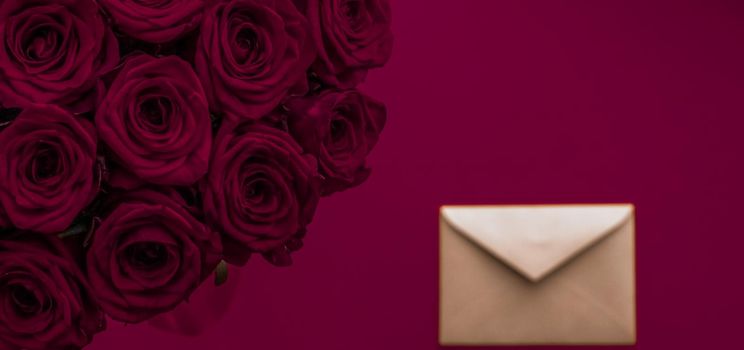 Holidays gift, floral present and happy relationship concept - Love letter and flowers delivery on Valentines Day, luxury bouquet of roses and card on maroon background for romantic holiday design