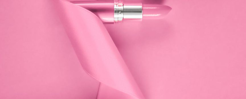 Cosmetic branding, glamour lip gloss and shopping sale concept - Luxury lipstick and silk ribbon on pink holiday background, make-up and cosmetics flatlay for beauty brand product design