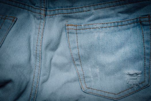 Jeans texture with pocket. Highly detailed closeup of blue jeans. Cool background.