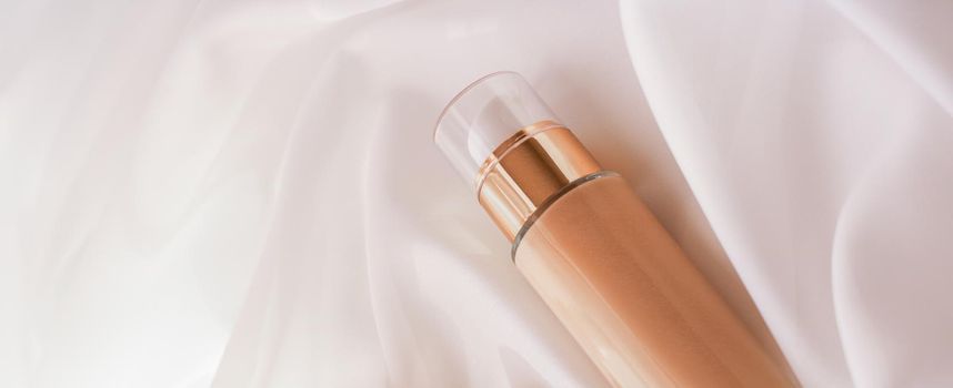 Cosmetic branding, glamour and skincare concept - Tonal bb cream bottle make-up fluid foundation base for nude skin color on silk background, cosmetics product as luxury beauty brand holiday design