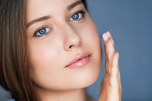 Beauty, skincare and cosmetic product, woman applying anti-aging face cream on her skin, portrait