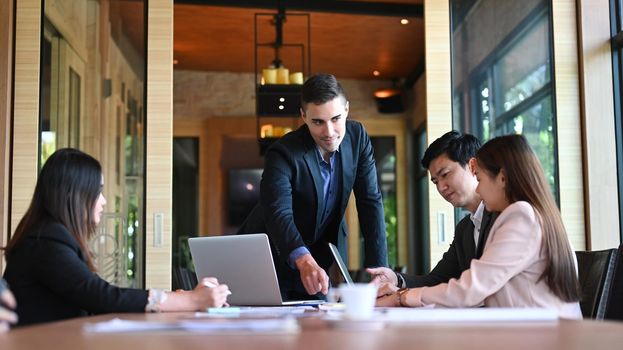 Group of business people discussing corporation project planning in boardroom.