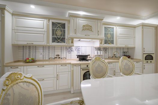 Interior renovation showcase of rich classic white kitchen