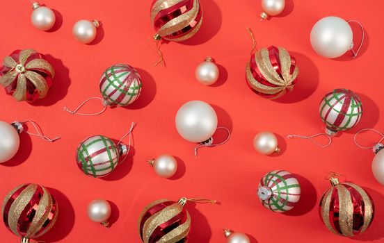 red and white shiny christmas balls on red backgroud, pattern. Winter, Cristmas and New year concept. Top view, flat lay