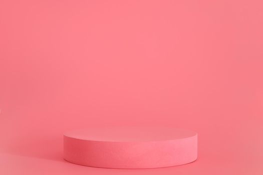 Pink podium on the pink background. Podium for product, cosmetic presentation. Creative mock up. Pedestal or platform for beauty products
