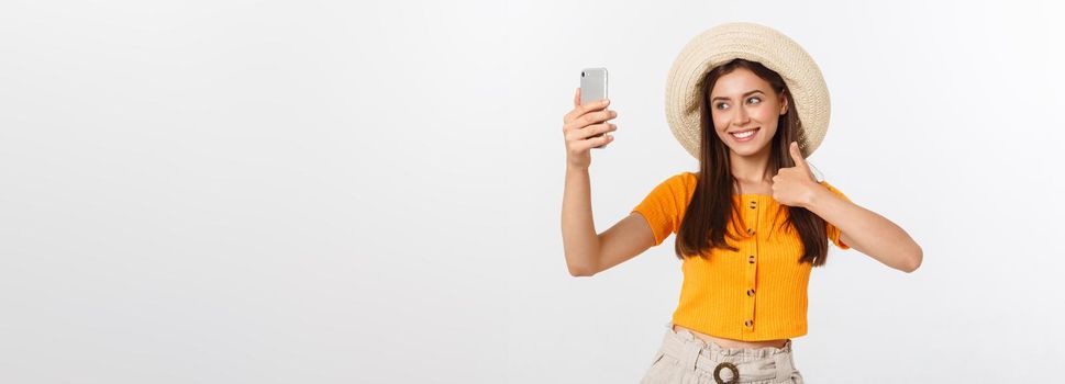 Young Caucasian woman enjoying the selfie with herself isolated on white background summer travel concept