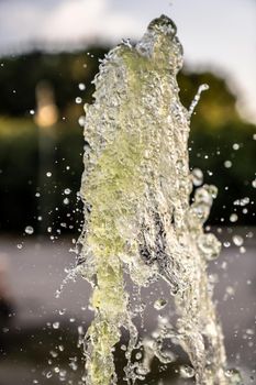 A jet of fountain water in the air. taken on a short shutter speed