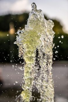 A jet of fountain water in the air. taken on a short shutter speed