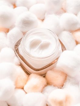 Cosmetic branding, moisturizing emulsion and facial care concept - Luxury face cream for sensitive skin and orange cotton balls on background, spa cosmetics and natural skincare beauty brand product