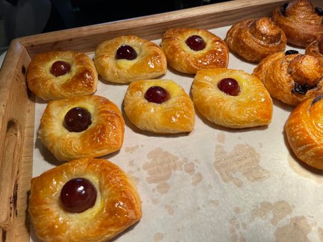 freshly baked danish pastry with apricot jam fruity jelly super delicious warm fresh buttery baked pastries with apricot and peach in bakery kitchen