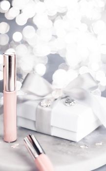 Cosmetic branding, Christmas glitter and girly blog concept - Holiday make-up foundation base, concealer and white gift box, luxury cosmetics present and blank label products for beauty brand design