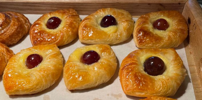 freshly baked danish pastry with apricot jam fruity jelly super delicious warm fresh buttery baked pastries with apricot and peach in bakery kitchen