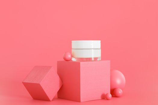 White unbranded cosmetic cream jar standing on pink podium. Skin care product presentation on the pink background. Trendy mockup. Skincare, beauty and spa