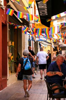 Benidorm, Alicante, Spain- September 10, 2022: Bars and terraces of typical spanish food full of people in the old town of Benidorm
