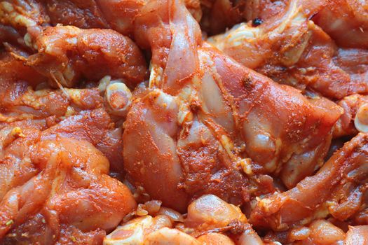 Close-up on marinating pieces of meat. Cooking