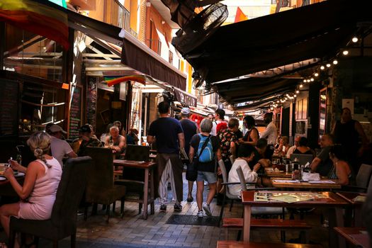 Benidorm, Alicante, Spain- September 10, 2022: Bars and terraces of typical spanish food full of people in the old town of Benidorm