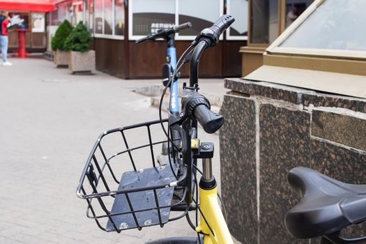 Handlebar and bicycle basket on the road close up