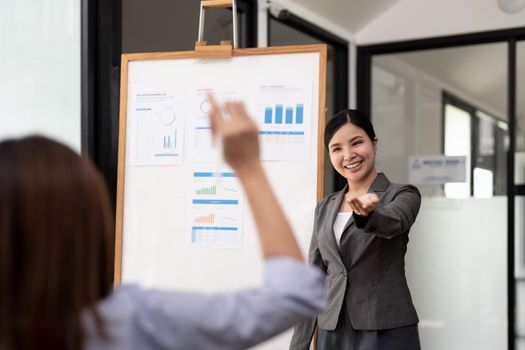Young asian businesswoman leader asking for opinion in the meeting room