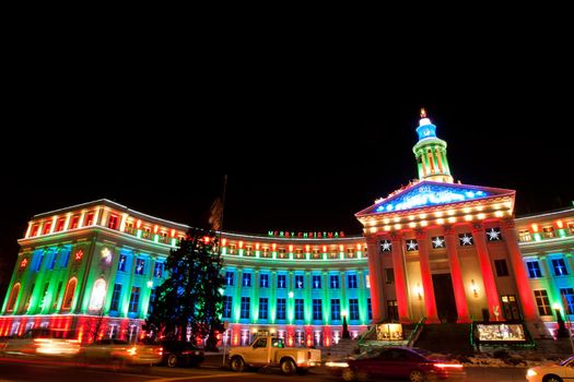Downtown Denver at Christmas. Denver's City and County building decorated with holiday lights.