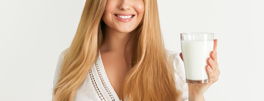 Diet, health and wellness concept, woman holding glass of milk or protein shake cocktail