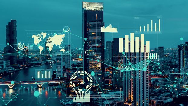 Business data analytic interface fly over smart city showing alteration future of business intelligence. Computer software and artificial intelligence are used to analyze big data for strategic plan .