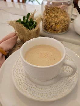 breakfast table with coffee and food