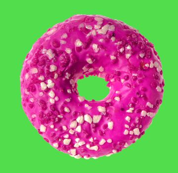 lush donut covered with cream, on a green background in isolation