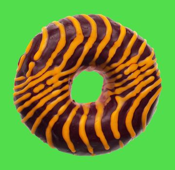 lush donut covered with cream, on a green background in isolation