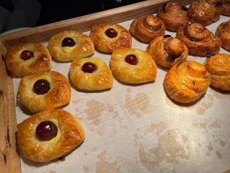 freshly baked danish pastry with apricot jam fruity jelly super delicious warm fresh buttery baked pastries with apricot and peach in bakery kitchen