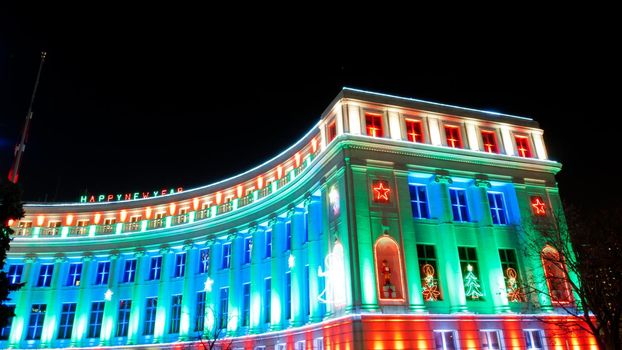 Downtown Denver at Christmas. Denver's City and County building decorated with holiday lights.