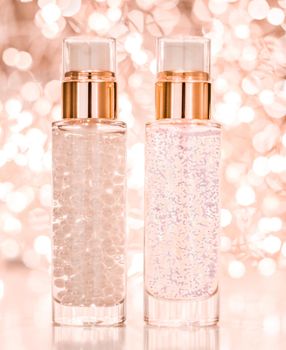 Cosmetic branding, blank label and glamour present concept - Holiday make-up base gel, serum emulsion, lotion bottle and rose gold glitter, luxury skin and body care cosmetics for beauty brand ads