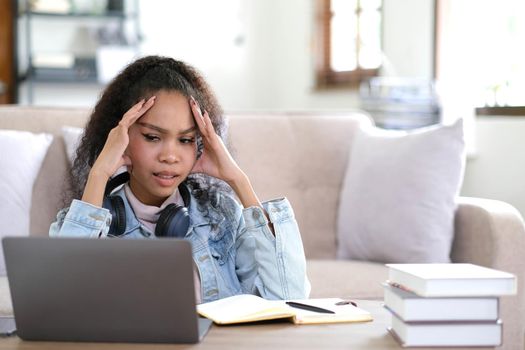 Work from home, Young asian woman struggle with laptop computer, Frustrated asia girl looking at laptop while studying online class, online business, e learning, People struggle with technology.