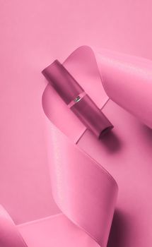 Cosmetic branding, glamour lip gloss and shopping sale concept - Luxury lipstick and silk ribbon on pink holiday background, make-up and cosmetics flatlay for beauty brand product design