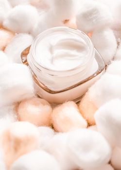 Cosmetic branding, moisturizing emulsion and facial care concept - Luxury face cream for sensitive skin and orange cotton balls on background, spa cosmetics and natural skincare beauty brand product