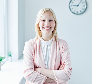 portrait of a young business woman holding a in the office