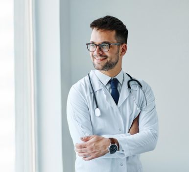 portrait of a young doctor in his office in a hospital