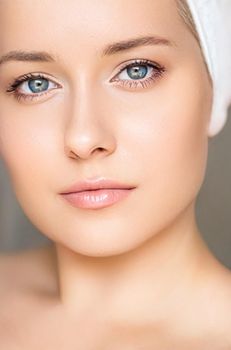 Skin care and beauty routine, beautiful woman with white towel wrapped around head, skincare cosmetics and face cosmetology, close-up portrait