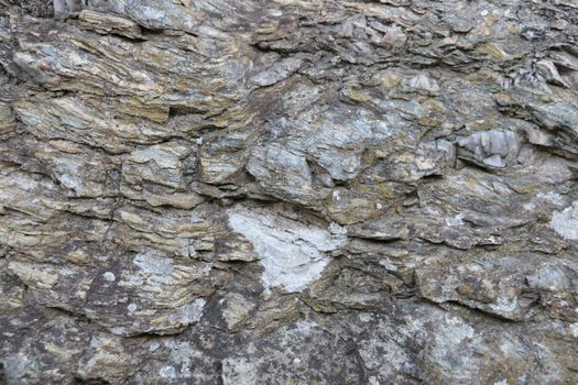 Close-up on the stone texture of mountain rock. Background