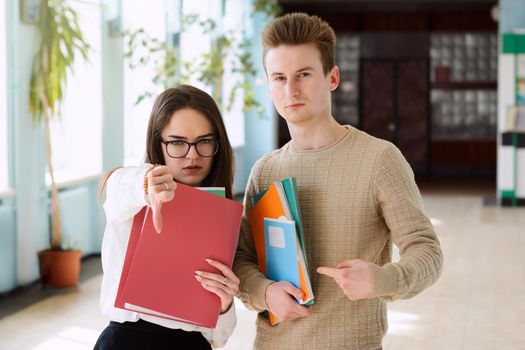 Distracted students looking to the camera without burning desire to study