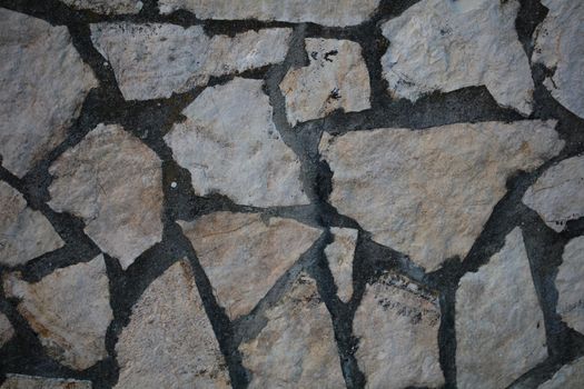 Twenty years old wall with stones in abandoned Kastri greek village retro background high quality big size prints