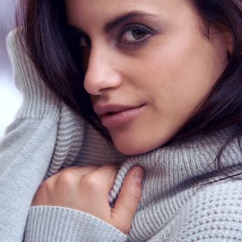 Warm, soft and sexy. Closeup of a beautiful brunette in winter clothing