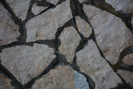 Twenty years old wall with stones in abandoned Kastri greek village retro background high quality big size prints